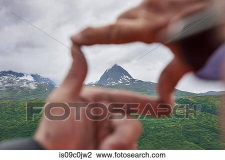 Senior man and son framing mountain peak with hands, close up, Valdez, Alaska, USA View Large Photo Image Stock Image - Senior man and son framing mountain peak with hands, close up, Valdez, Alaska, USA. Fotosearch