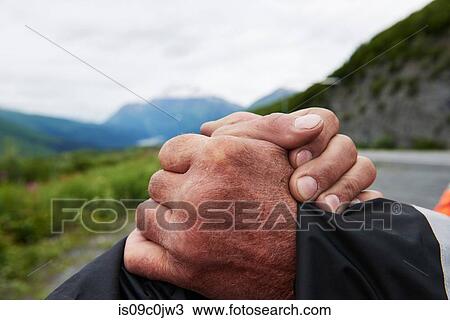 Senior man and son shaking hands in mountain landscape, close up, Valdez, Alaska, USA View Large Photo Image Stock Image - Senior man and son shaking hands in mountain landscape, close up, Valdez, Alaska, USA. Fotosearch