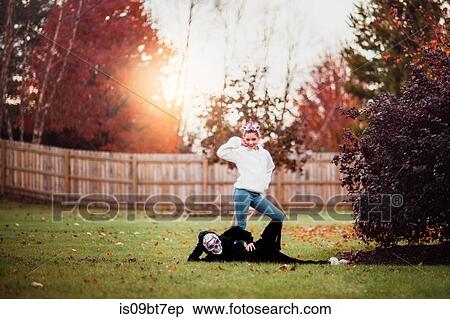 Siblings in halloween costume posing in park View Large Photo Image Stock Photography - Siblings in halloween costume posing in park. Fotosearch