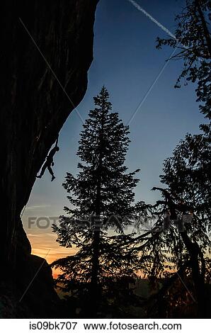 Silhouette of rock climber rock climbing at sunset, Flagstone, Eugene, Oregon, United States View Large Photo Image Stock Photo - Silhouette of rock climber rock climbing at sunset, Flagstone, Eugene, Oregon, United States. Fotosearch