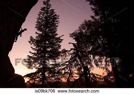 Silhouette of rock climber rock climbing at sunset, Flagstone, Eugene, Oregon, United States View Large Photo Image Stock Photograph - Silhouette of rock climber rock climbing at sunset, Flagstone, Eugene, Oregon, United States. Fotosearch