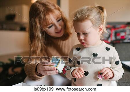 Sisters preparing for Christmas View Large Photo Image Stock Photo - Sisters preparing for Christmas. Fotosearch