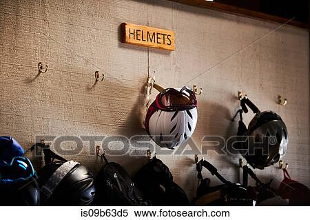 Ski helmets on coat hooks on hut wall View Large Photo Image Stock Photography - Ski helmets on coat hooks on hut wall. Fotosearch