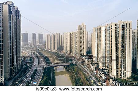 Skyscrapers along river, Leifeng, Hunan, China View Large Photo Image Stock Image - Skyscrapers along river, Leifeng, Hunan, China. Fotosearch