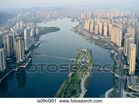 Skyscrapers lining river, Yingwanchen, Hunan, China View Large Photo Image Stock Image - Skyscrapers lining river, Yingwanchen, Hunan, China. Fotosearch