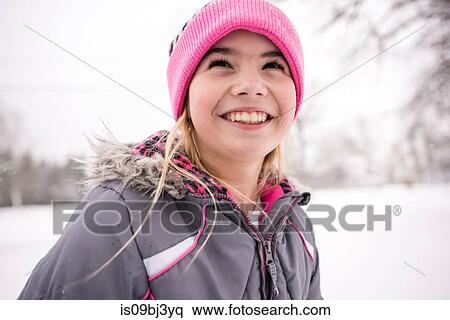 Smiling girl in winter clothing View Large Photo Image Stock Photography - Smiling girl in winter clothing. Fotosearch