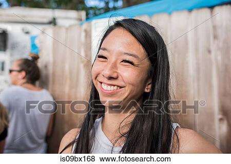 Smiling woman by wooden fence, Haleiwa, Oahu, Hawaii View Large Photo Image Stock Photo - Smiling woman by wooden fence, Haleiwa, Oahu, Hawaii. Fotosearch