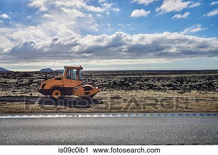 Steam roller making path on side of road, Grindavk, Gullbringusysla, Iceland View Large Photo Image Stock Image - Steam roller making path on side of road, Grindavk, Gullbringusysla, Iceland. Fotosearch