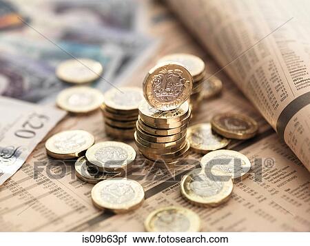Still life of British currency on financial newspaper, close-up View Large Photo Image Stock Image - Still life of British currency on financial newspaper, close-up. Fotosearch