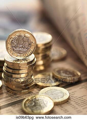 Still life of British currency on financial newspaper, close-up View Large Photo Image Stock Image - Still life of British currency on financial newspaper, close-up. Fotosearch