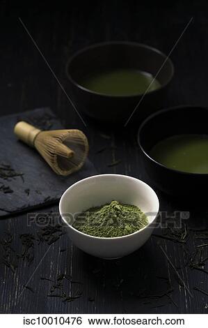 Still life of matcha tea preparation with whisk and bowls of matcha tea and tea powder, low key View Large Photo Image Stock Photograph - Still life of matcha tea preparation with whisk and bowls of matcha tea and tea powder, low key. Fotosearch