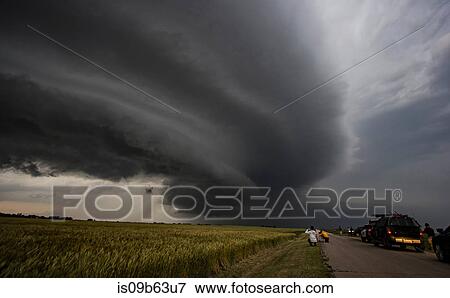Storm chasers watching arcus cloud and shelf cloud over rural area, Enid, Oklahoma, United States, North America View Large Photo Image Stock Photo - Storm chasers watching arcus cloud and shelf cloud over rural area, Enid, Oklahoma, United States, North America. Fotosearch