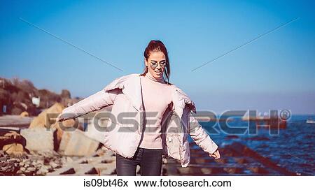 Stylish mid adult woman balancing on beach, Odessa, Odeska Oblast, Ukraine View Large Photo Image Stock Photo - Stylish mid adult woman balancing on beach, Odessa, Odeska Oblast, Ukraine. Fotosearch