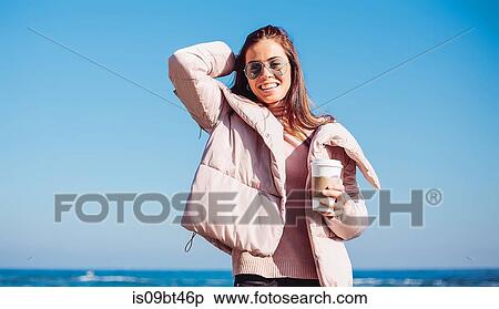Stylish mid adult woman on beach against blue sky, portrait, Odessa, Odeska Oblast, Ukraine View Large Photo Image Stock Photography - Stylish mid adult woman on beach against blue sky, portrait, Odessa, Odeska Oblast, Ukraine. Fotosearch