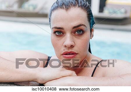 Sultry mid adult woman in outdoor swimming pool, head and shoulder portrait, Cape Town, South Africa View Large Photo Image Stock Photo - Sultry mid adult woman in outdoor swimming pool, head and shoulder portrait, Cape Town, South Africa. Fotosearch