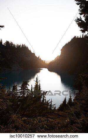 Sunset over Alpine Blue Lake, Washington, USA View Large Photo Image Stock Photo - Sunset over Alpine Blue Lake, Washington, USA. Fotosearch