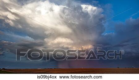 Stock Photo - Supercell coloured by setting sun, Ogallala, Nebraska, US. Fotosearch