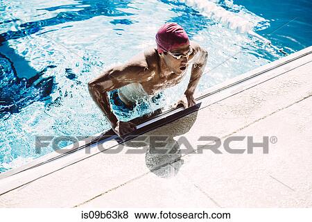 Swimmer climbing out of pool View Large Photo Image Stock Photo - Swimmer climbing out of pool. Fotosearch
