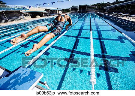 Stock Photography - Swimmer diving into pool. Fotosearch
