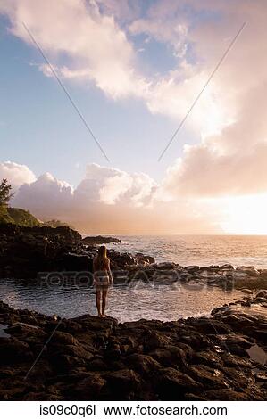 Stock Image - Swimmer enjoying enclosed sea pool, Princeville, Hawaii, US. Fotosearch