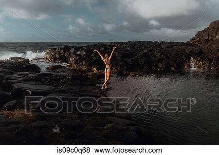 Stock Photo - Swimmer enjoying enclosed sea pool, Princeville, Hawaii, US. Fotosearch
