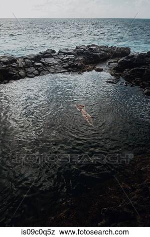 Swimmer in enclosed sea pool, Princeville, Hawaii, US View Large Photo Image Stock Photo - Swimmer in enclosed sea pool, Princeville, Hawaii, US. Fotosearch