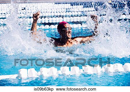 Swimmer in pool beating water in triumph View Large Photo Image Stock Photography - Swimmer in pool beating water in triumph. Fotosearch