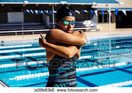 Swimmer in swimming cap and goggles by pool View Large Photo Image Stock Photograph - Swimmer in swimming cap and goggles by pool. Fotosearch
