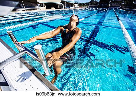 Swimmer in water at end of pool View Large Photo Image Picture - Swimmer in water at end of pool. Fotosearch