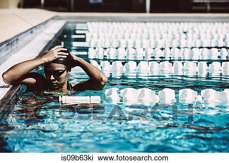 Swimmer in water at end of pool View Large Photo Image Stock Image - Swimmer in water at end of pool. Fotosearch
