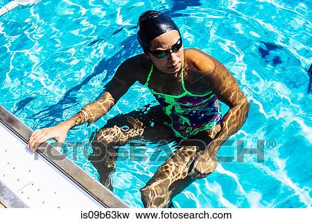 Swimmer in water at end of pool View Large Photo Image Stock Photo - Swimmer in water at end of pool. Fotosearch