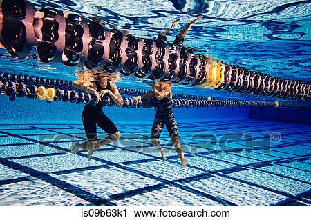 Swimmer resting on lane divider in pool talking to friend View Large Photo Image Stock Image - Swimmer resting on lane divider in pool talking to friend. Fotosearch