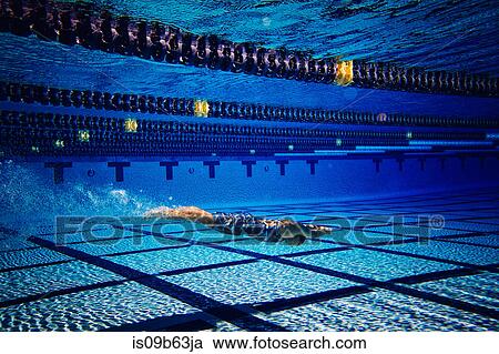 Swimmer underwater in pool View Large Photo Image Stock Image - Swimmer underwater in pool. Fotosearch
