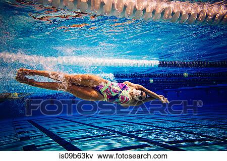 Swimmer underwater in pool View Large Photo Image Stock Photo - Swimmer underwater in pool. Fotosearch