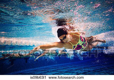 Swimmers doing freestyle in lane View Large Photo Image Stock Image - Swimmers doing freestyle in lane. Fotosearch
