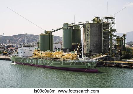 Tanker by storage tanks in harbour, Tokushima-shi, Tokushima, Japan View Large Photo Image Picture - Tanker by storage tanks in harbour, Tokushima-shi, Tokushima, Japan. Fotosearch