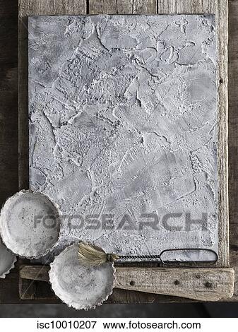 Tartlet tins on textured slate tray View Large Photo Image Stock Photo - Tartlet tins on textured slate tray. Fotosearch