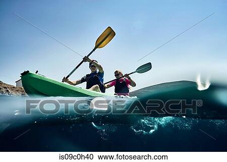 Teenage boy and mother sea kayaking on ocean, surface level view, Limnos, Khios, Greece View Large Photo Image Stock Image - Teenage boy and mother sea kayaking on ocean, surface level view, Limnos, Khios, Greece. Fotosearch