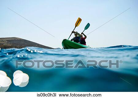 Teenage boy and mother sea kayaking, surface level view, Limnos, Khios, Greece View Large Photo Image Stock Image - Teenage boy and mother sea kayaking, surface level view, Limnos, Khios, Greece. Fotosearch