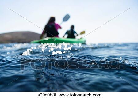 Teenage boy and mother sea kayaking, surface level shallow focus view, Limnos, Khios, Greece View Large Photo Image Stock Photograph - Teenage boy and mother sea kayaking, surface level shallow focus view, Limnos, Khios, Greece. Fotosearch