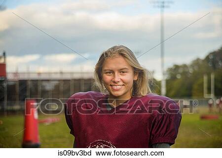 Teenage female football player on field View Large Photo Image Stock Image - Teenage female football player on field. Fotosearch