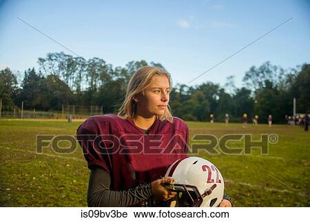 Teenage female football player on field View Large Photo Image Stock Image - Teenage female football player on field. Fotosearch