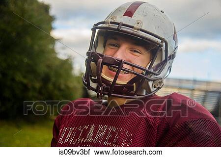 Stock Image - Teenage male football player on field. Fotosearch