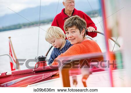 Three generation family on sailing boat, Geneva, Switzerland, Europe View Large Photo Image Picture - Three generation family on sailing boat, Geneva, Switzerland, Europe. Fotosearch
