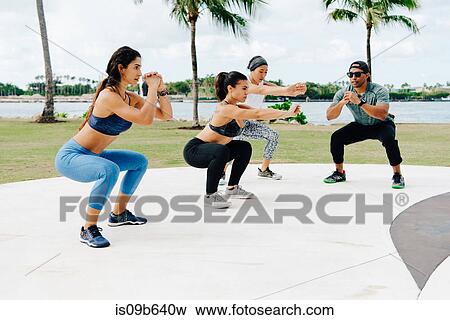 Three women working out with personal trainer, South Point Park, Miami Beach, Florida, USA View Large Photo Image Stock Photo - Three women working out with personal trainer, South Point Park, Miami Beach, Florida, USA. Fotosearch