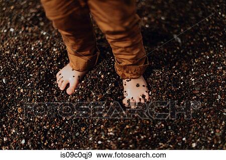 Toddler's feet on pebbles at beach View Large Photo Image Stock Photo - Toddler's feet on pebbles at beach. Fotosearch