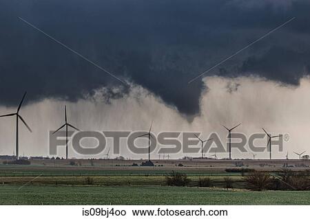 Tornado (with no visible contact over ground) behind wind farm over rural Kansas, US View Large Photo Image Picture - Tornado (with no visible contact over ground) behind wind farm over rural Kansas, US. Fotosearch