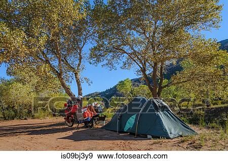 Touring motorcycle and tent, Zion National Park camping, Utah, USA View Large Photo Image Stock Photo - Touring motorcycle and tent, Zion National Park camping, Utah, USA. Fotosearch