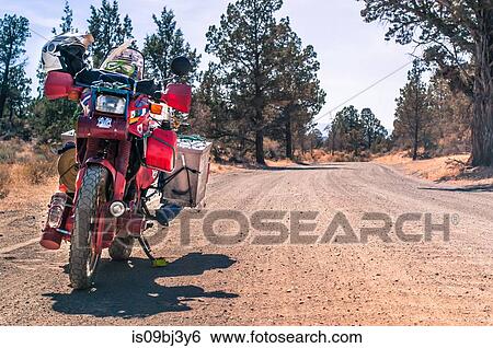 Stock Photograph - Touring motorcycle on roadside, Terrebonne, Oregon, USA. Fotosearch