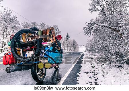 Touring motorcycle parked on roadside in winter, Placerville, California, USA View Large Photo Image Stock Photo - Touring motorcycle parked on roadside in winter, Placerville, California, USA. Fotosearch